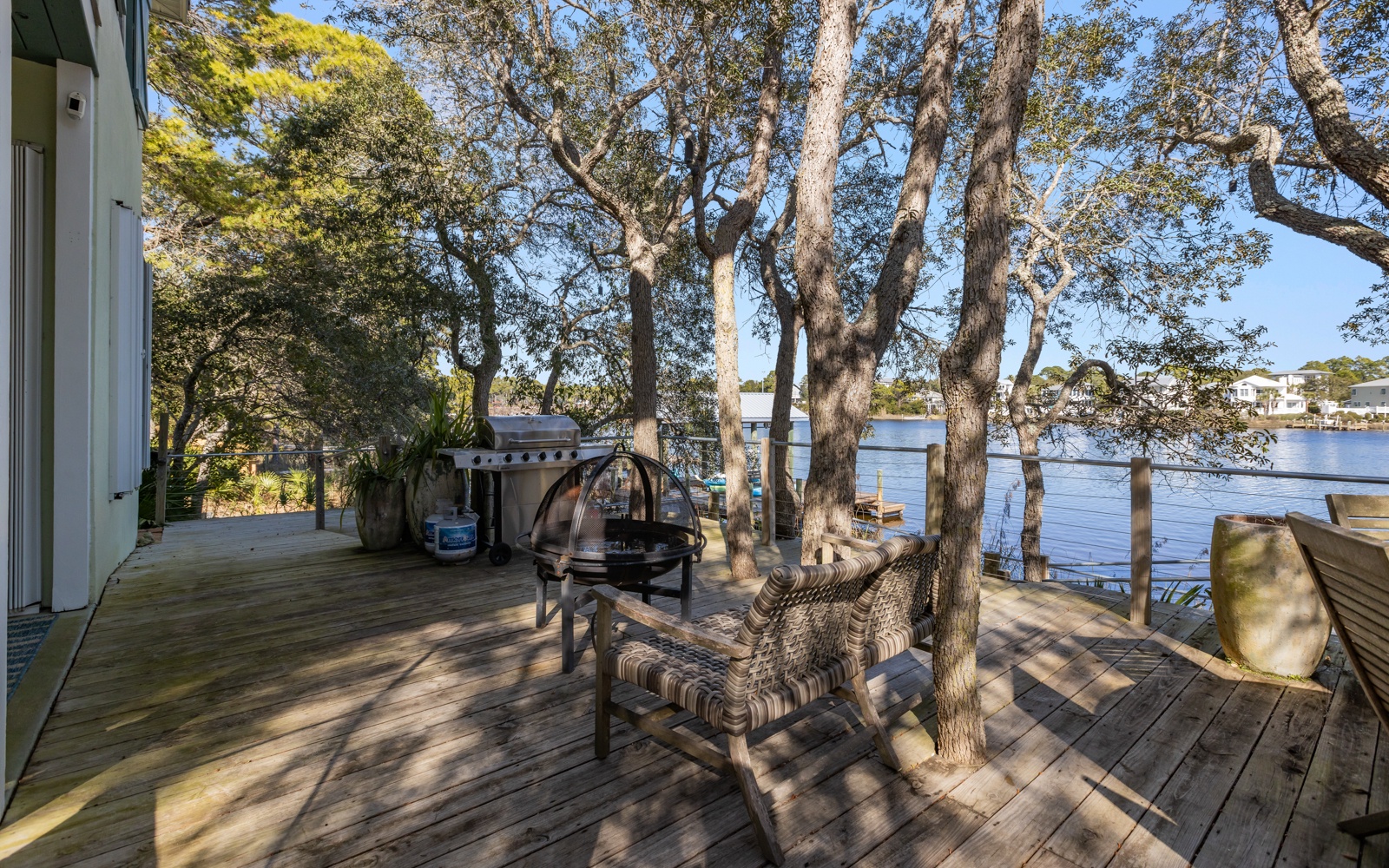 Relax on your private waterfront deck surrounded by mature trees, complete with BBQ facilities and stunning water views.