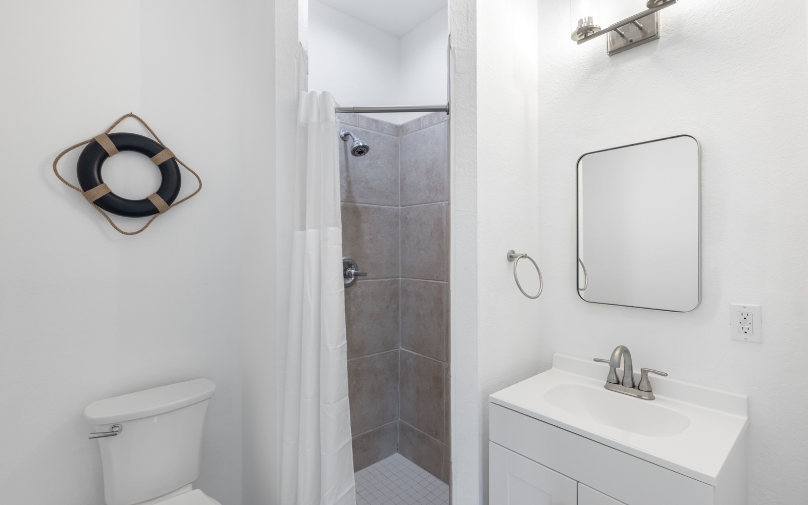 Your private bathroom features a refreshing walk-in shower and modern vanity for your comfort.