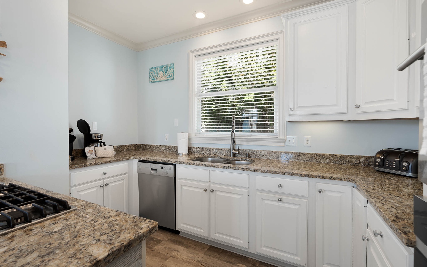 Your fully equipped kitchen features granite countertops, stainless steel appliances, and everything you need for memorable meals during your stay.