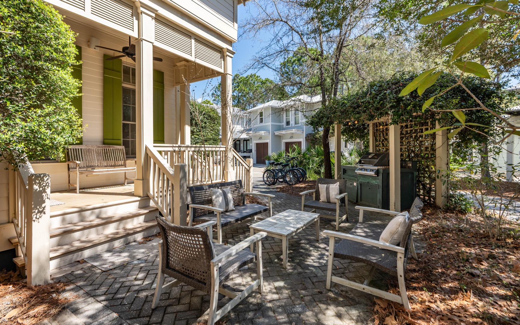 Relax in your private courtyard oasis with comfortable seating and lush greenery creating the perfect outdoor retreat.