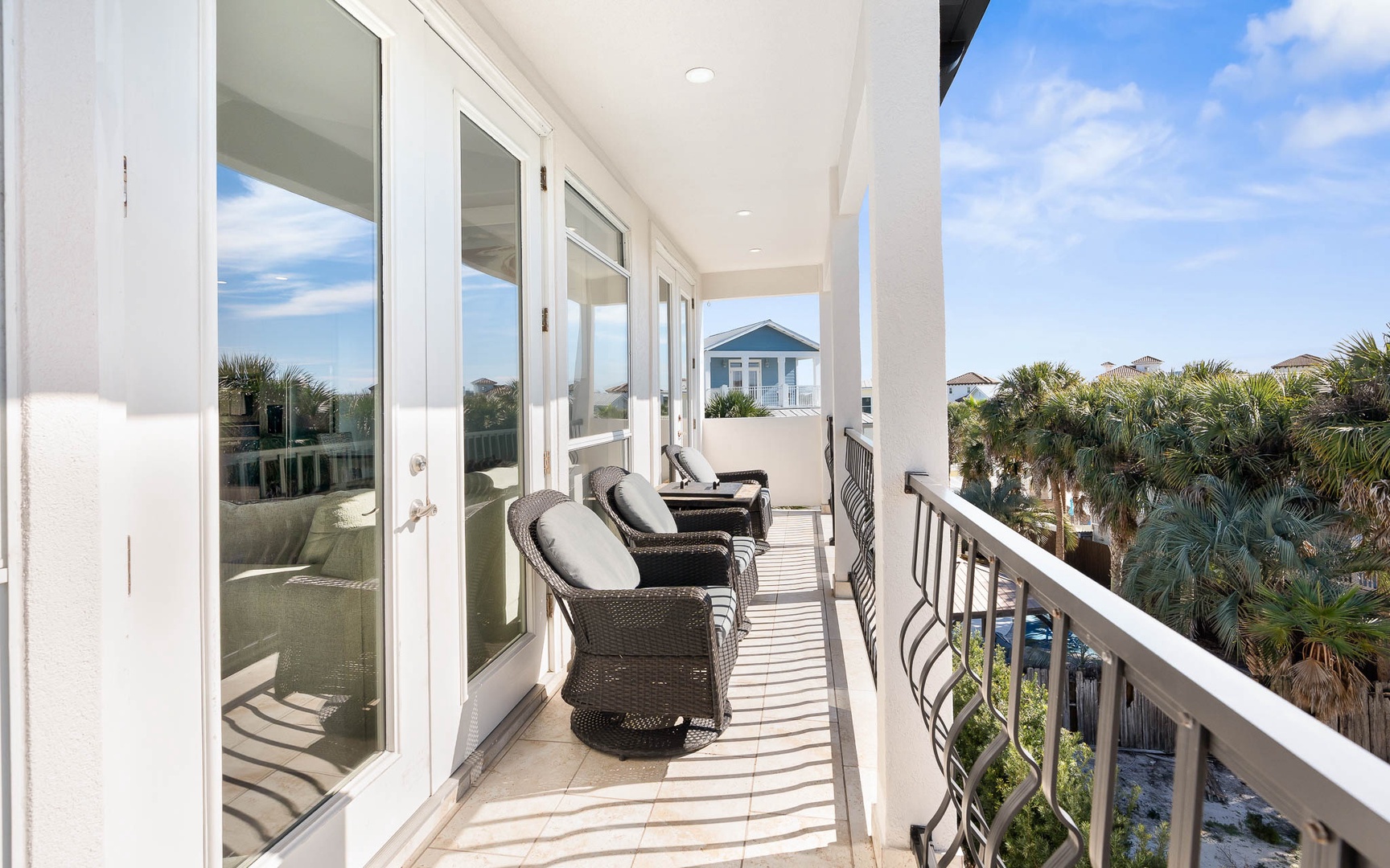 Relax on your private balcony with comfortable seating and tropical views, perfect for morning coffee or sunset unwinding.