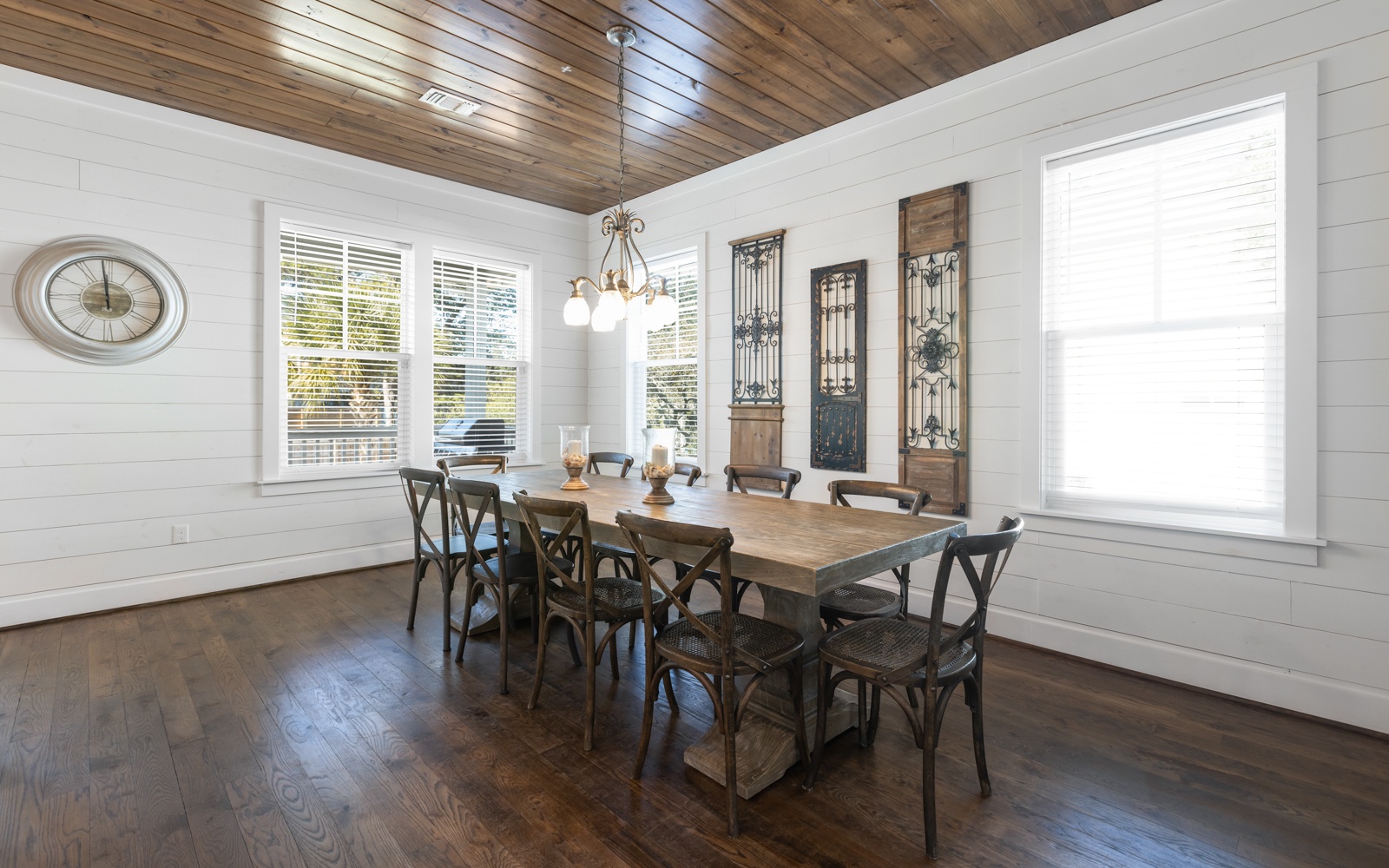 Gather around this beautiful farmhouse dining table where your group can share memorable meals beneath the stunning wood ceiling.