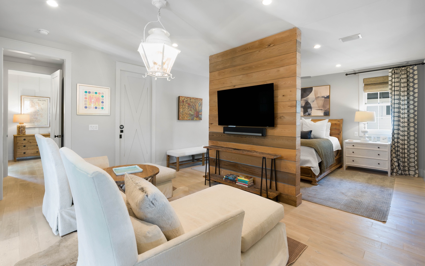 Relax in your elegant suite where warm wood accents and plush seating create the perfect retreat for unwinding after exploring.