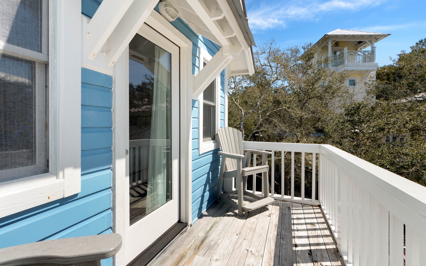 Step onto your private balcony and breathe in the fresh coastal air while relaxing in your comfortable chair overlooking the treetops.