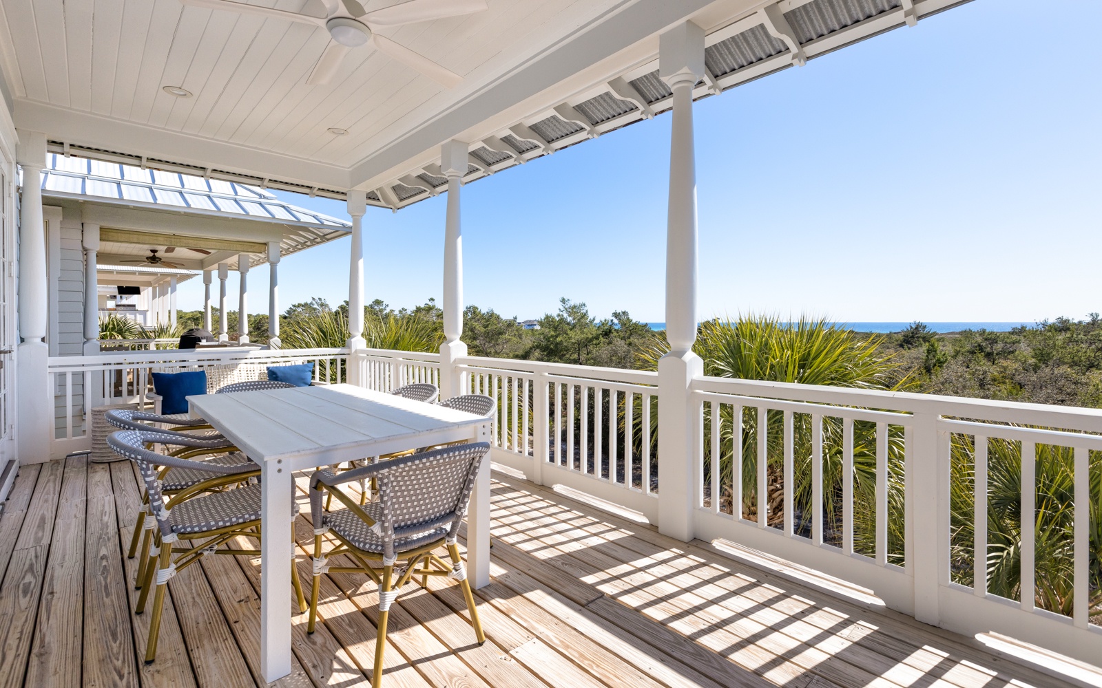 Your gulf view deck awaits with comfortable dining space and tropical breezes, perfect for morning coffee or sunset dinners.