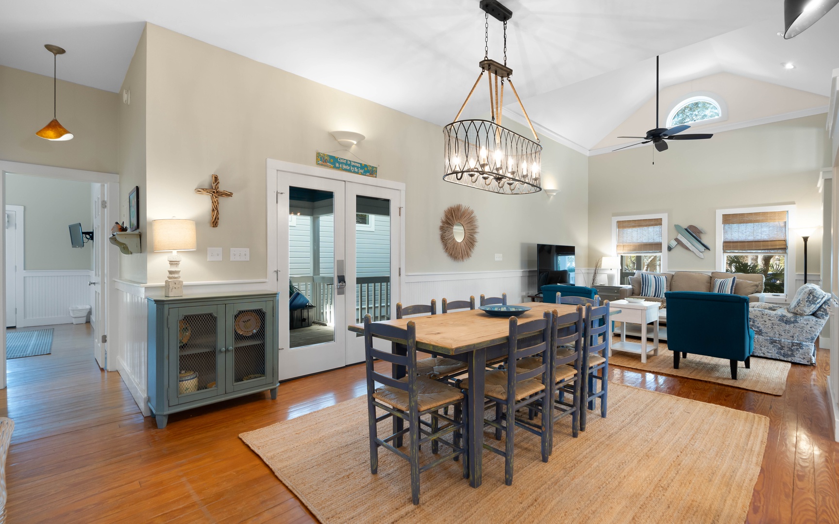 Gather around your spacious dining table for memorable meals, with coastal charm flowing through this open, sunlit space.