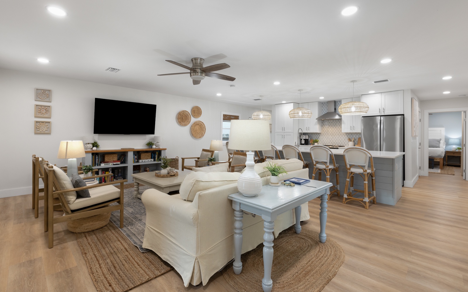 Relax in your bright, airy open-concept space where coastal charm meets modern comfort. You'll love the seamless flow from living to kitchen.