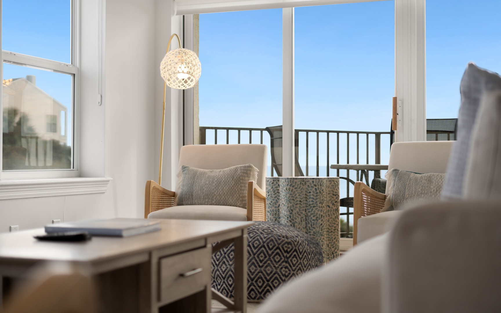 Settle into your stylish living space with comfortable seating and floor-to-ceiling windows that fill the room with natural light.