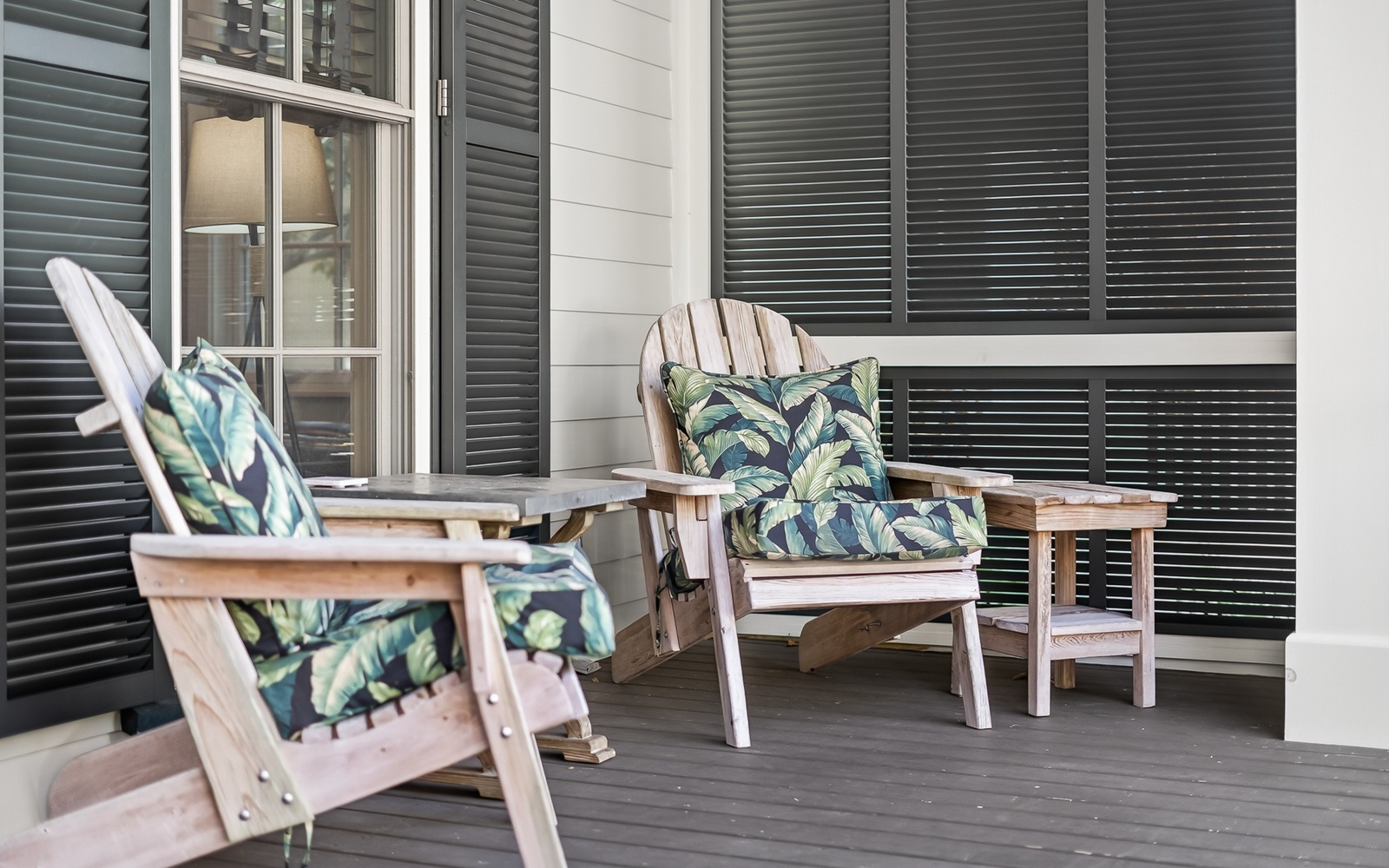 Sink into your private porch chairs with tropical cushions, perfect for morning coffee or evening relaxation.