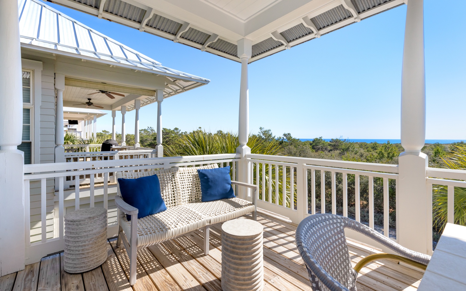 Relax on your private balcony with gulf views, where comfortable seating and coastal breezes create the perfect spot to unwind.