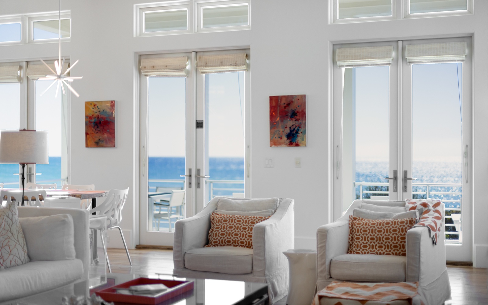 Relax in this bright living space where floor-to-ceiling windows frame stunning gulf views and modern comfort awaits.