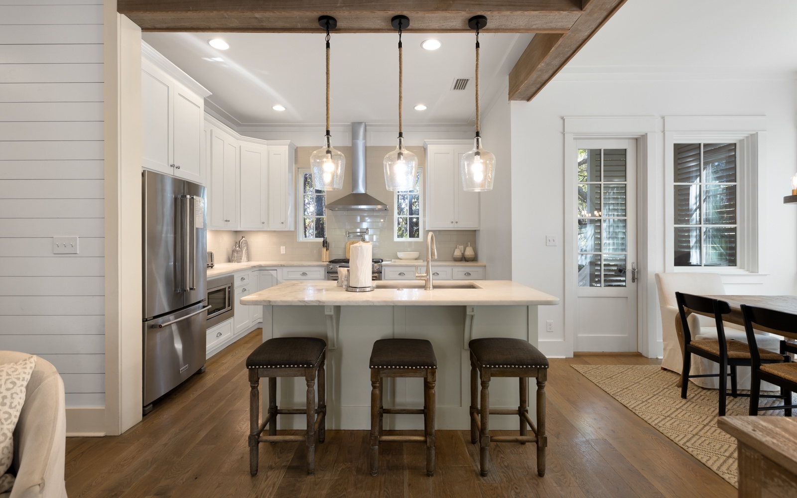 Your gourmet kitchen awaits with marble countertops, professional appliances, and a spacious island perfect for morning coffee or evening meals.