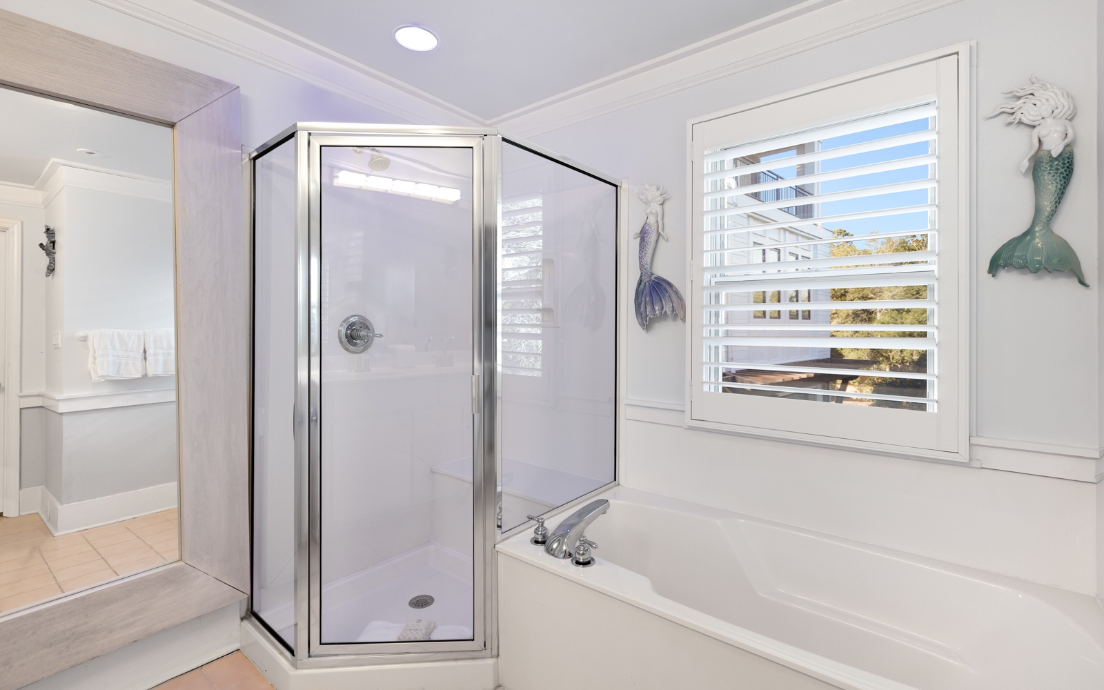 Unwind in your elegant master bathroom with a luxurious soaking tub and separate glass shower.
