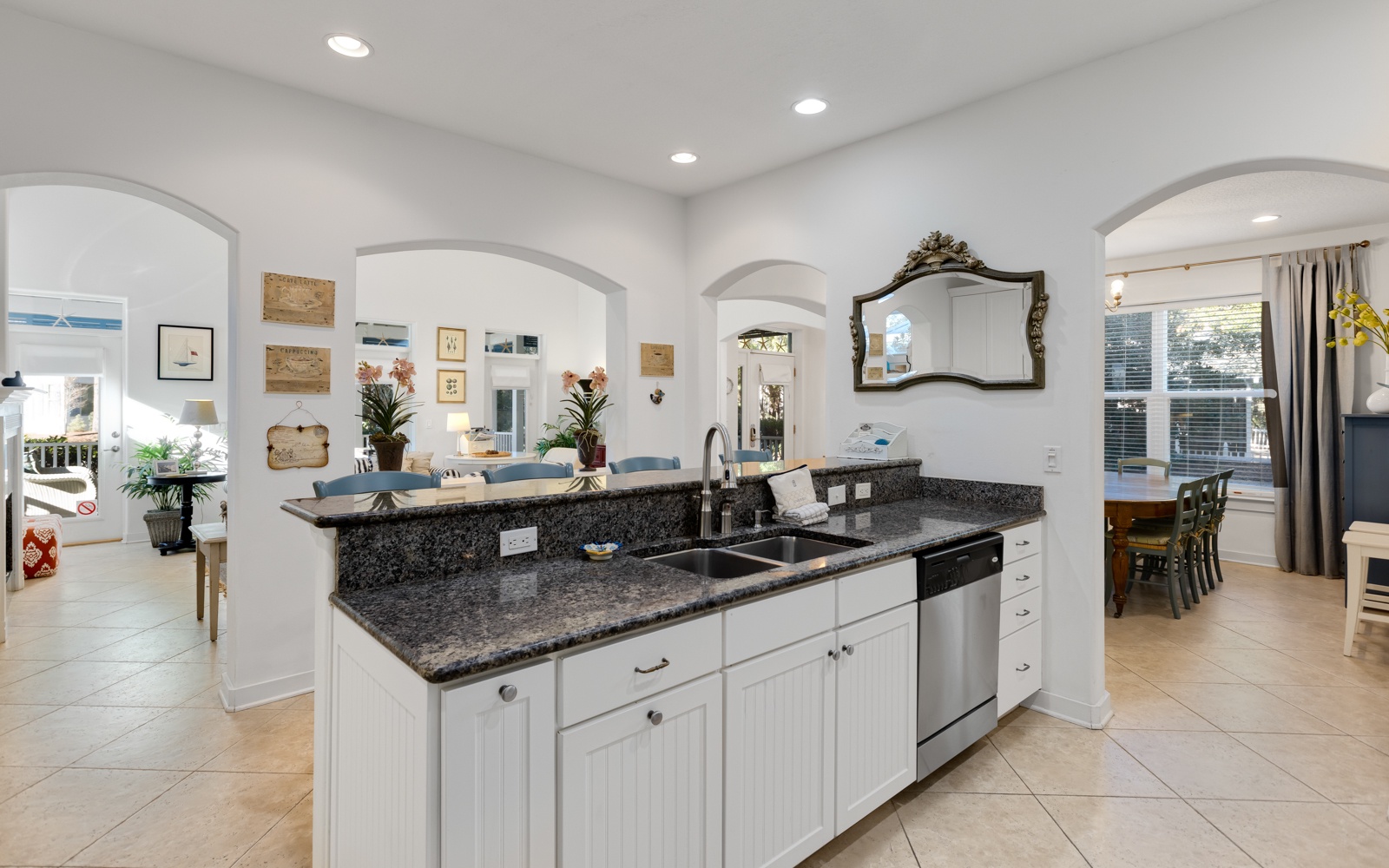 Cook your favorite meals in this elegant kitchen featuring granite countertops, stainless steel appliances, and an open island perfect for gathering.