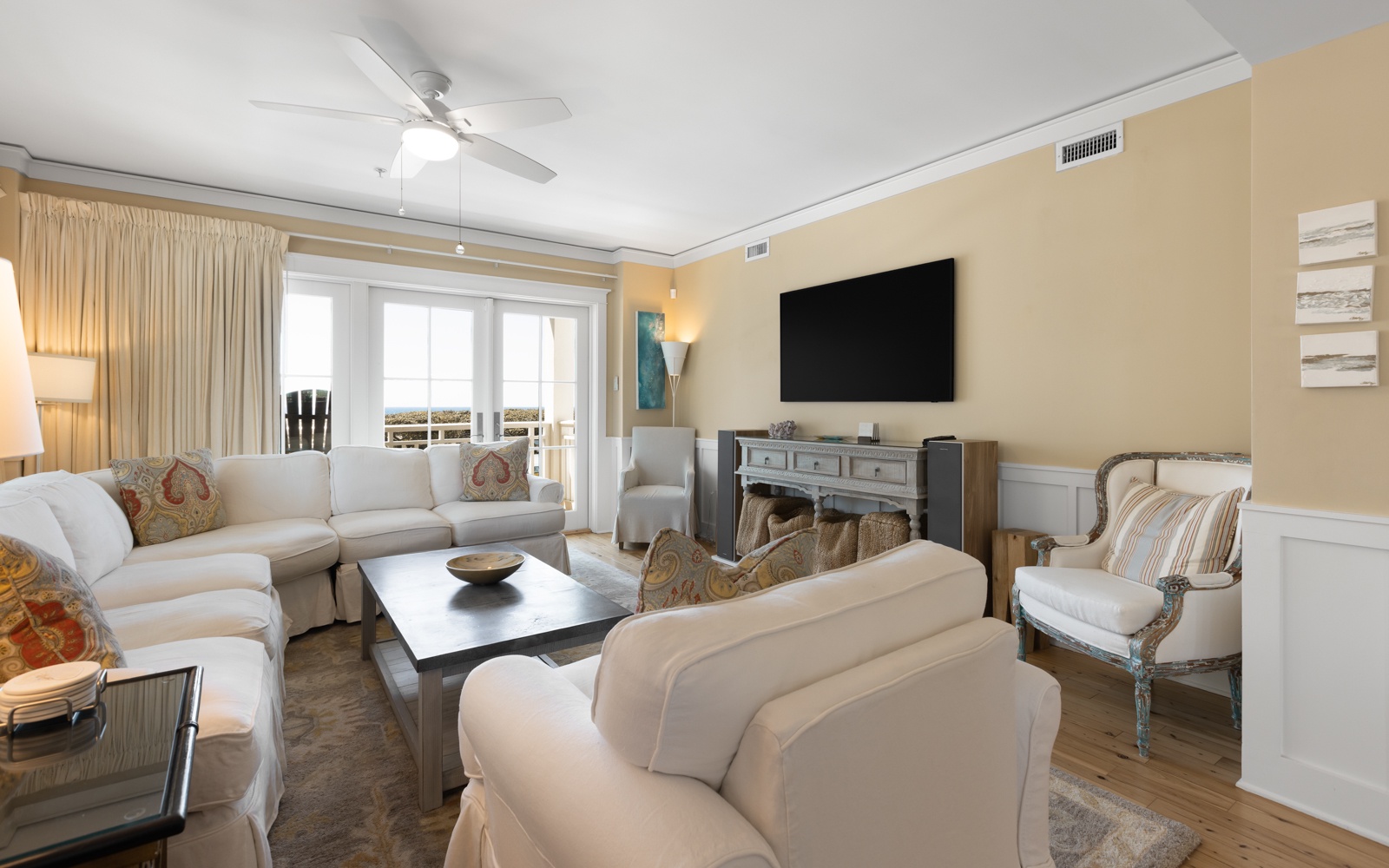 Sink into plush sofas in your elegant living room, where the fireplace adds warmth and large windows frame beautiful views.