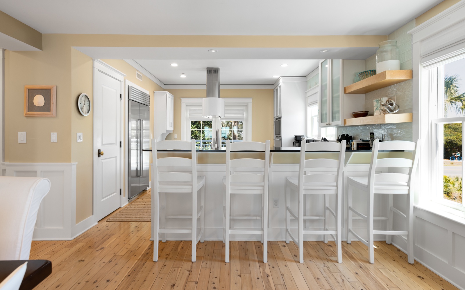 Gather around this gorgeous kitchen island where you'll create delicious meals together on gleaming counters with premium appliances.