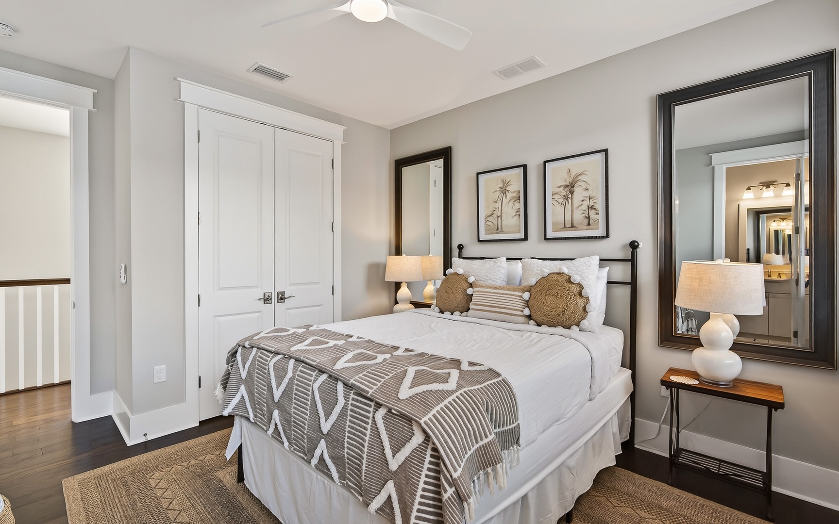 Your serene master retreat features crisp white linens, warm earth tones, and thoughtful details that invite restful nights.