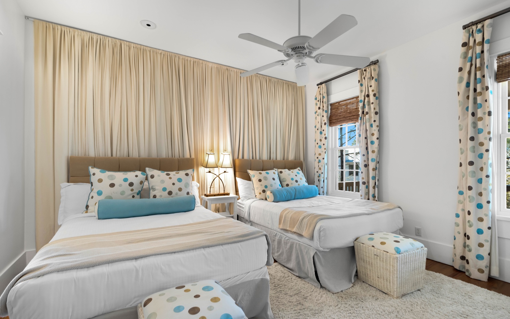 Rest peacefully in this serene twin bedroom, where soft blue accents and plush linens create your perfect retreat.