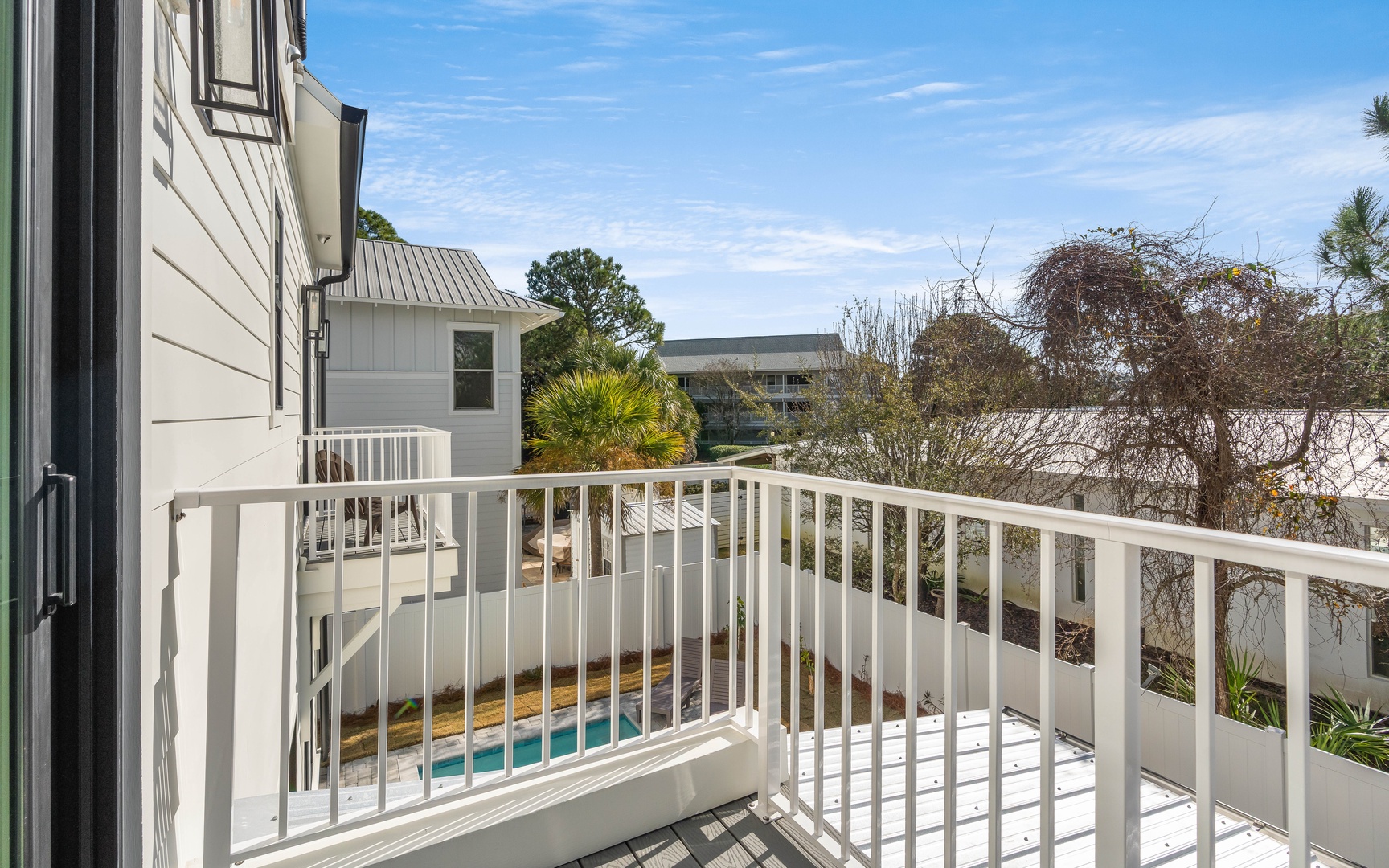 Step onto your private balcony and breathe in the fresh air while enjoying peaceful views of the surrounding area and sparkling pool below.