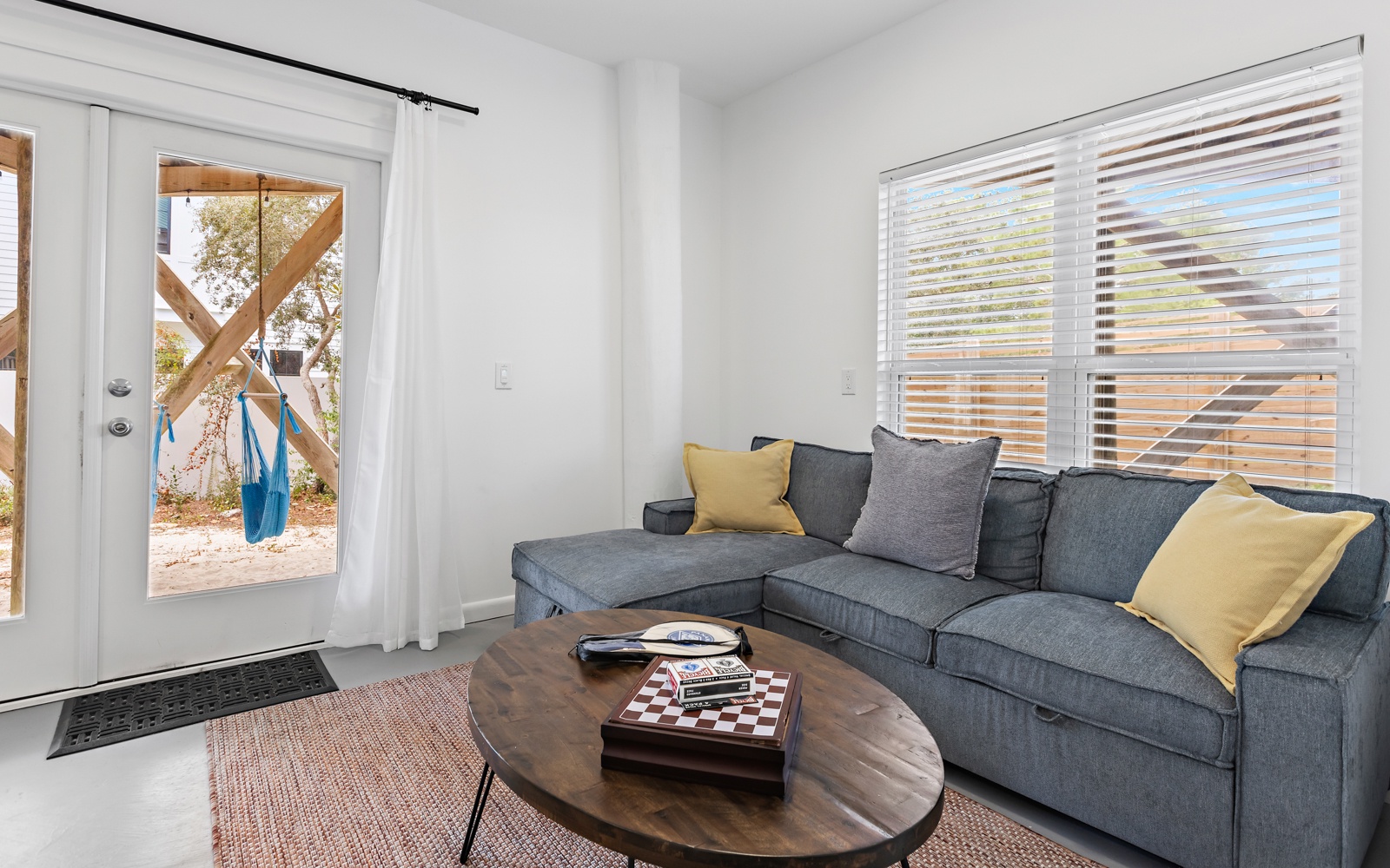 Sink into this cozy sectional sofa where morning coffee and evening conversations flow naturally in your bright, airy living space.