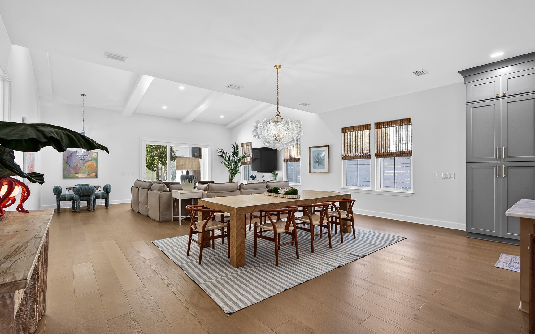 Unwind in this stunning open-concept space where natural light floods your dining and living areas through oversized windows.