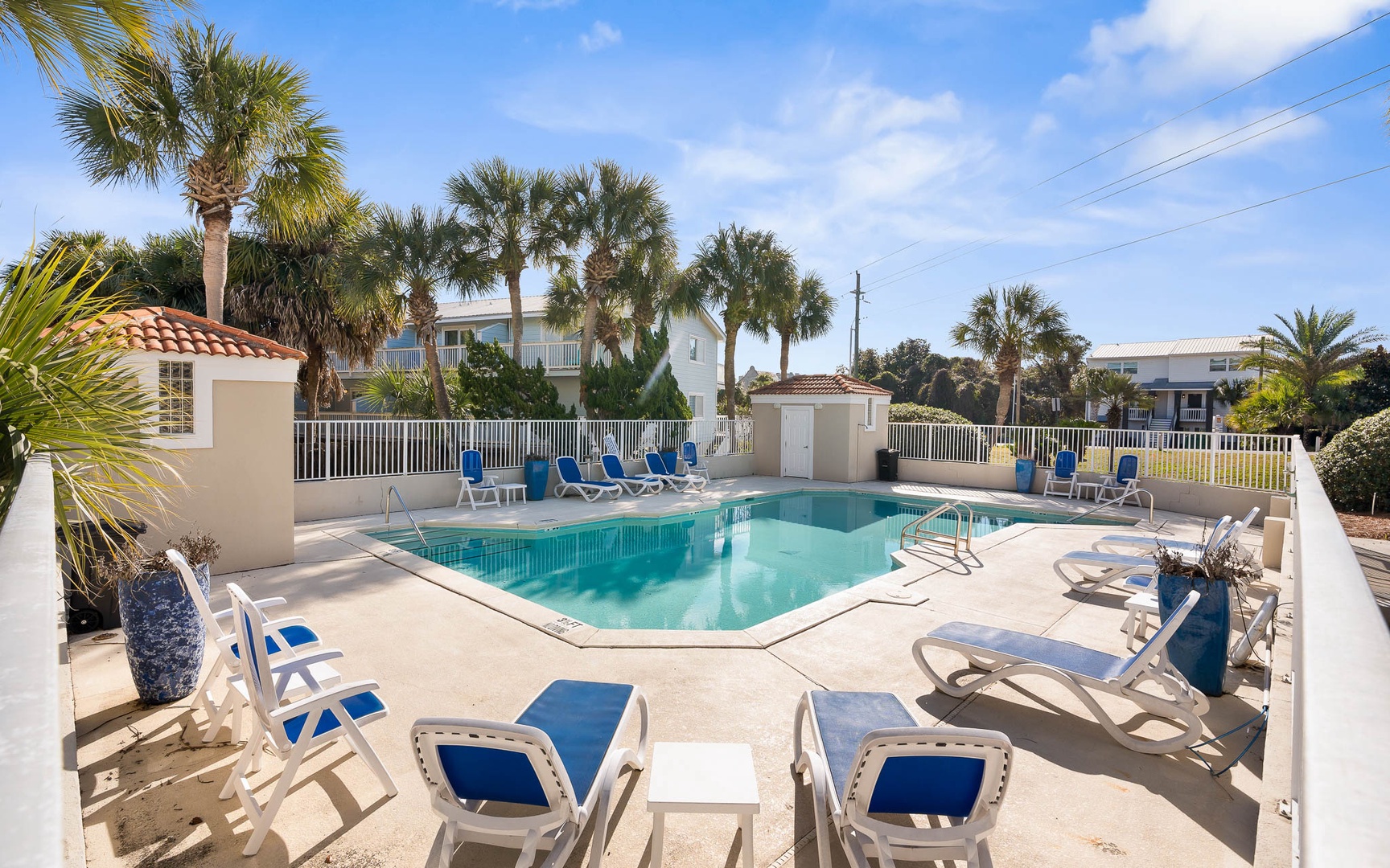 Dive into your private pool paradise, surrounded by swaying palms and comfortable lounge chairs for perfect poolside relaxation.