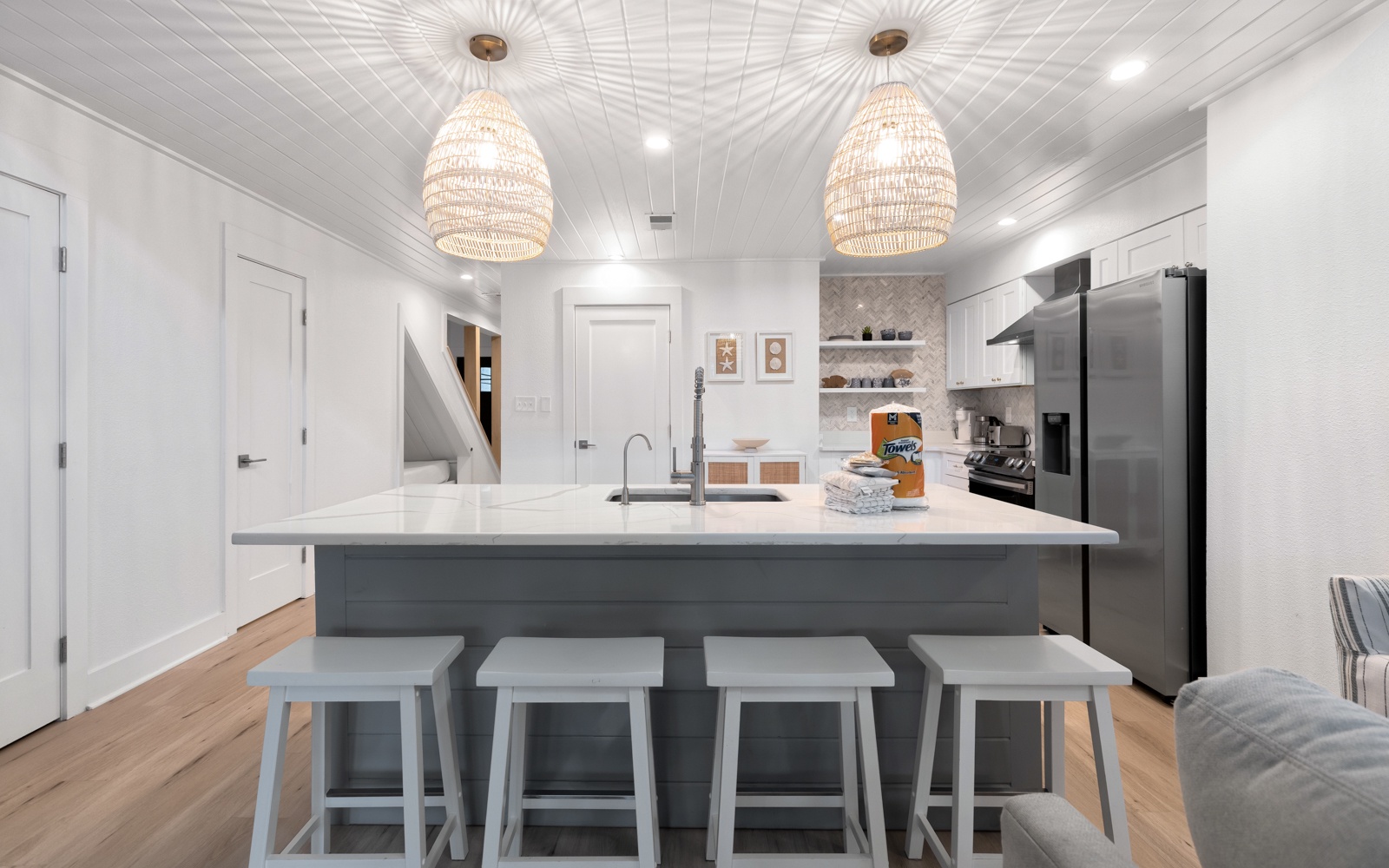 Your stylish kitchen awaits with a spacious island for gathering, modern appliances, and elegant pendant lighting creating the perfect culinary retreat.