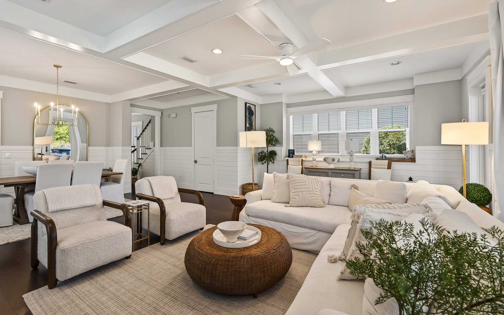 Sink into plush sofas in your elegant living space, where coffered ceilings and warm lighting create the perfect retreat.