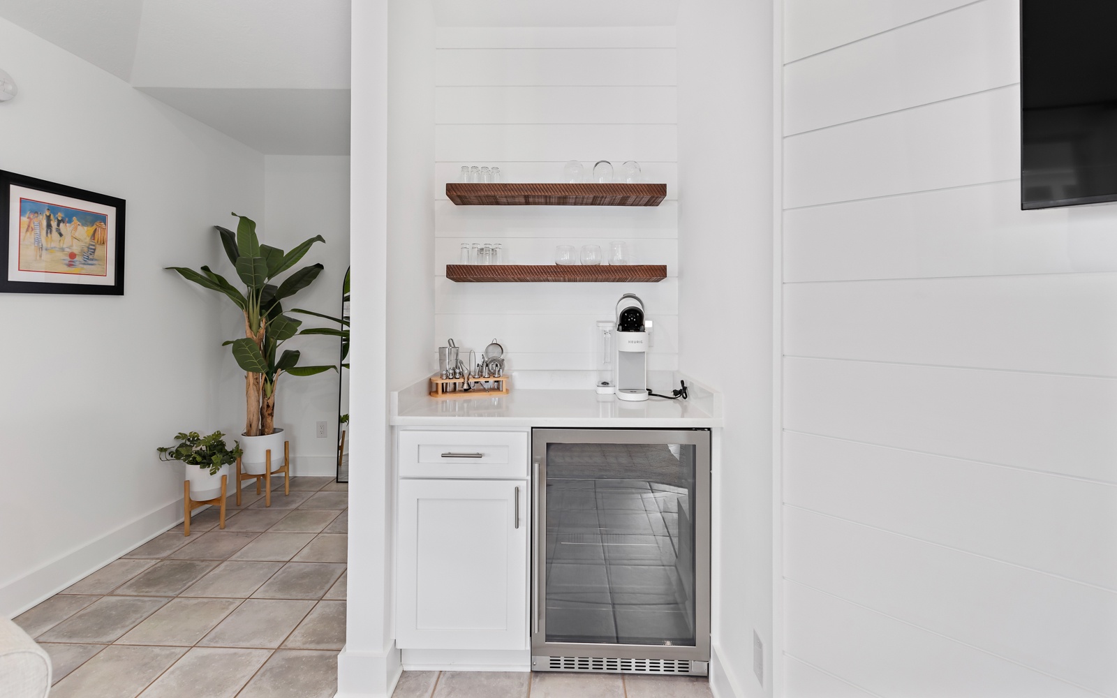 Your stylish kitchenette features a wine cooler and coffee station, perfect for morning brews and evening relaxation.