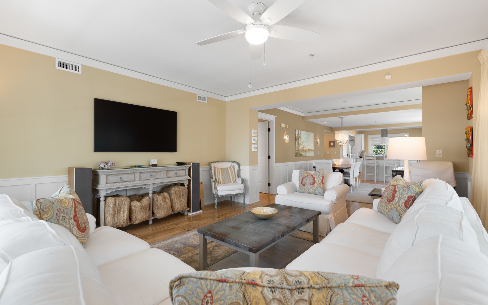 Unwind in your spacious living room featuring plush seating, warm lighting, and entertainment center for memorable evenings together.