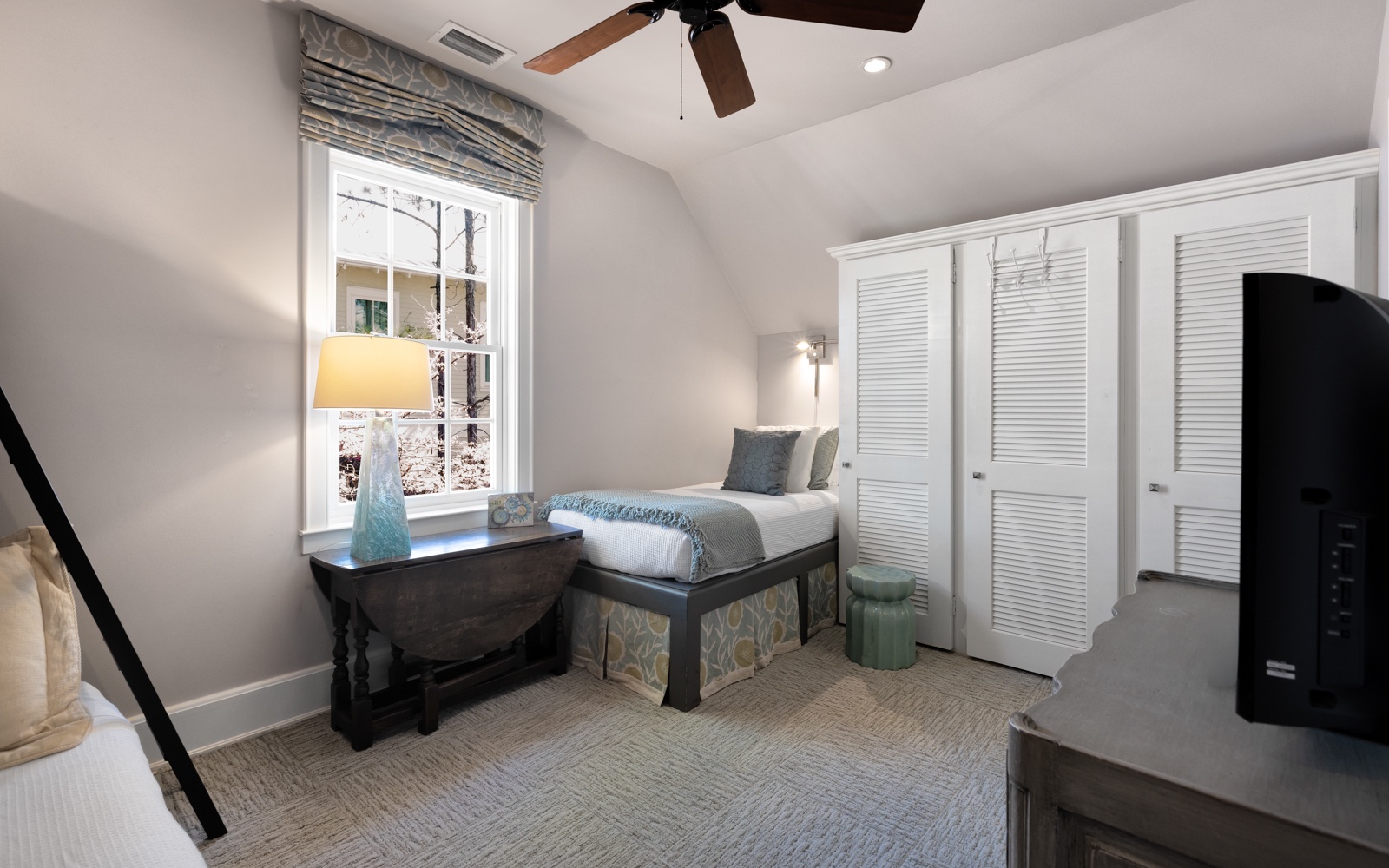 Settle into this serene bedroom featuring a cozy window nook with city views, elegant built-in wardrobes, and thoughtful touches throughout.