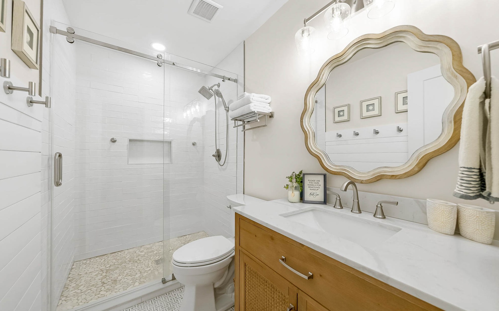 Step into your spa-like bathroom featuring elegant marble counters, gleaming fixtures, and a spacious walk-in shower perfect for unwinding.