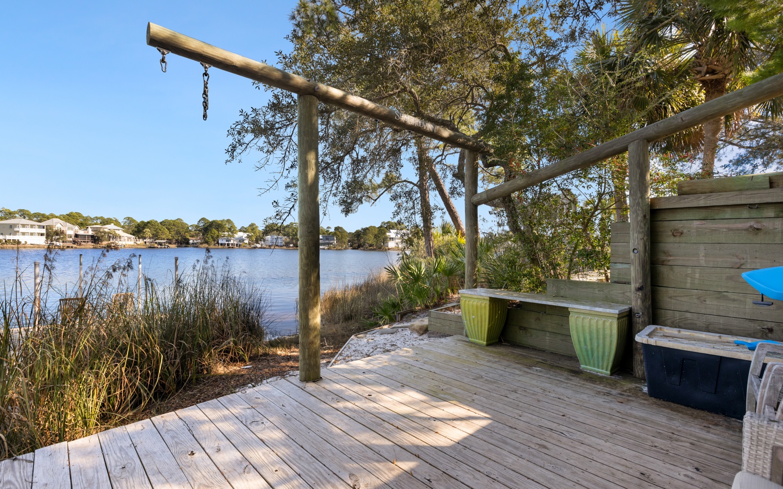 Waterfront deck with lake views and outdoor exercise equipment creates your perfect morning workout spot.