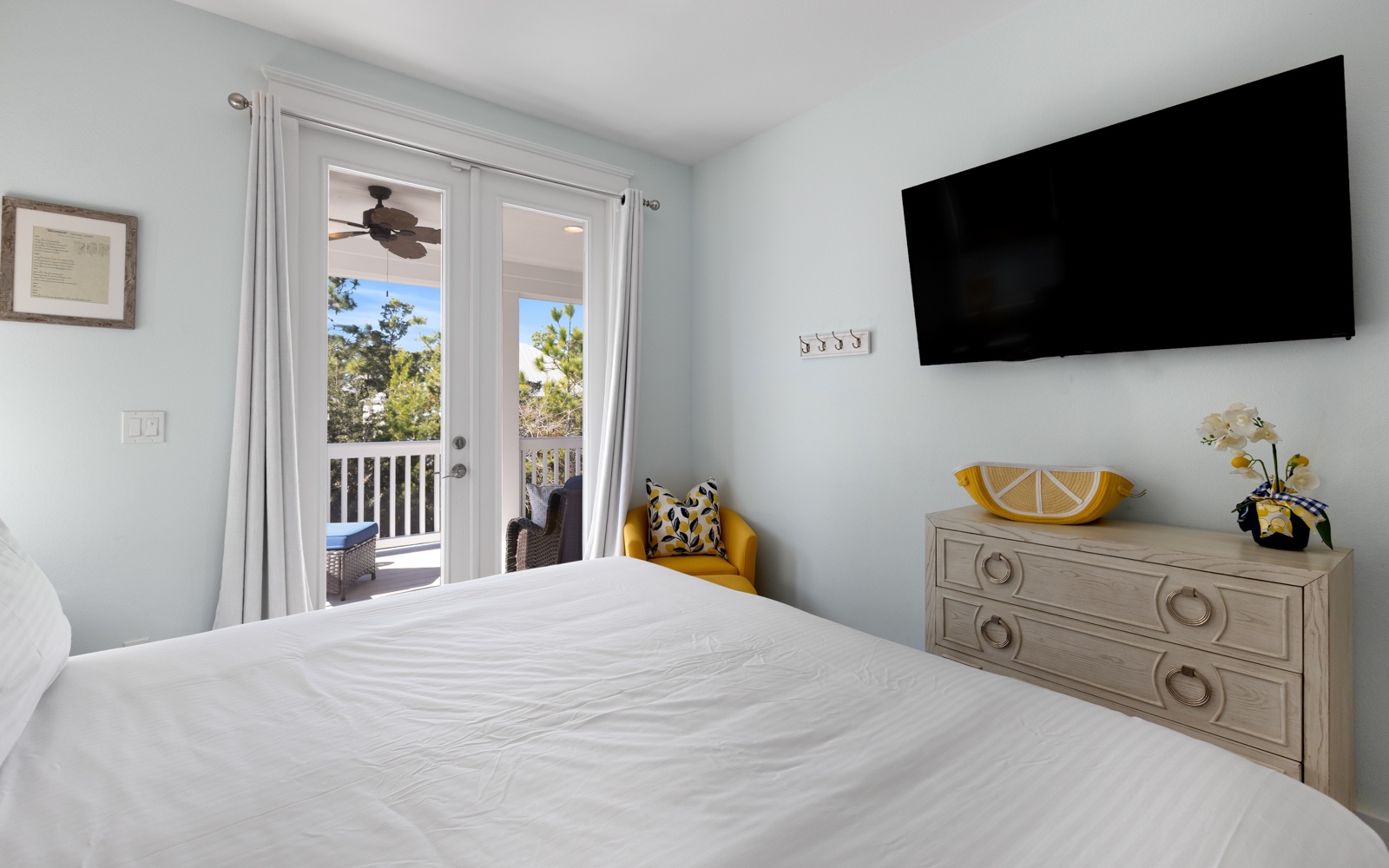 Wake up to natural light streaming through your French doors, leading to your private balcony with peaceful treetop views.