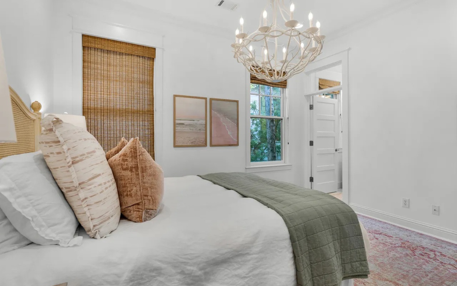 Sink into crisp linens and soft textures in your serene bedroom retreat, where natural light filters through bamboo shades.