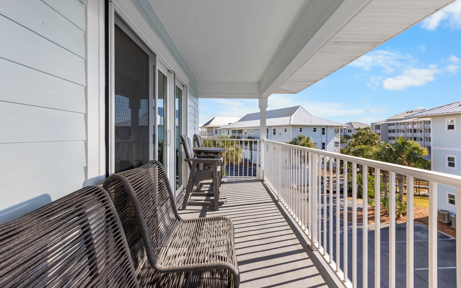Your private balcony offers peaceful views and comfortable seating where you can start your morning with coffee or unwind after a day of coastal adventures.