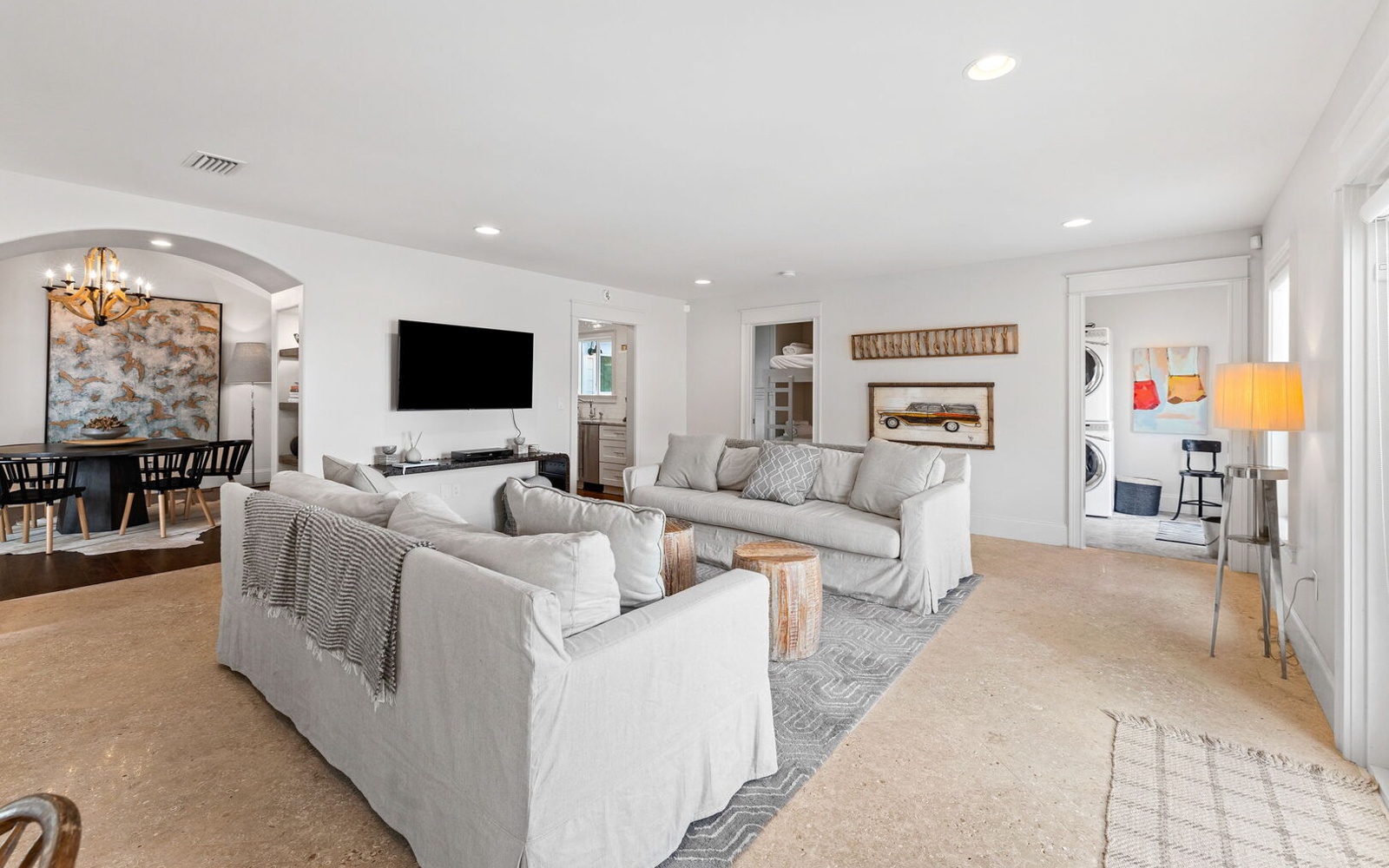 Sink into plush gray sofas while you stream your favorite shows on the large TV in this bright, airy living space.