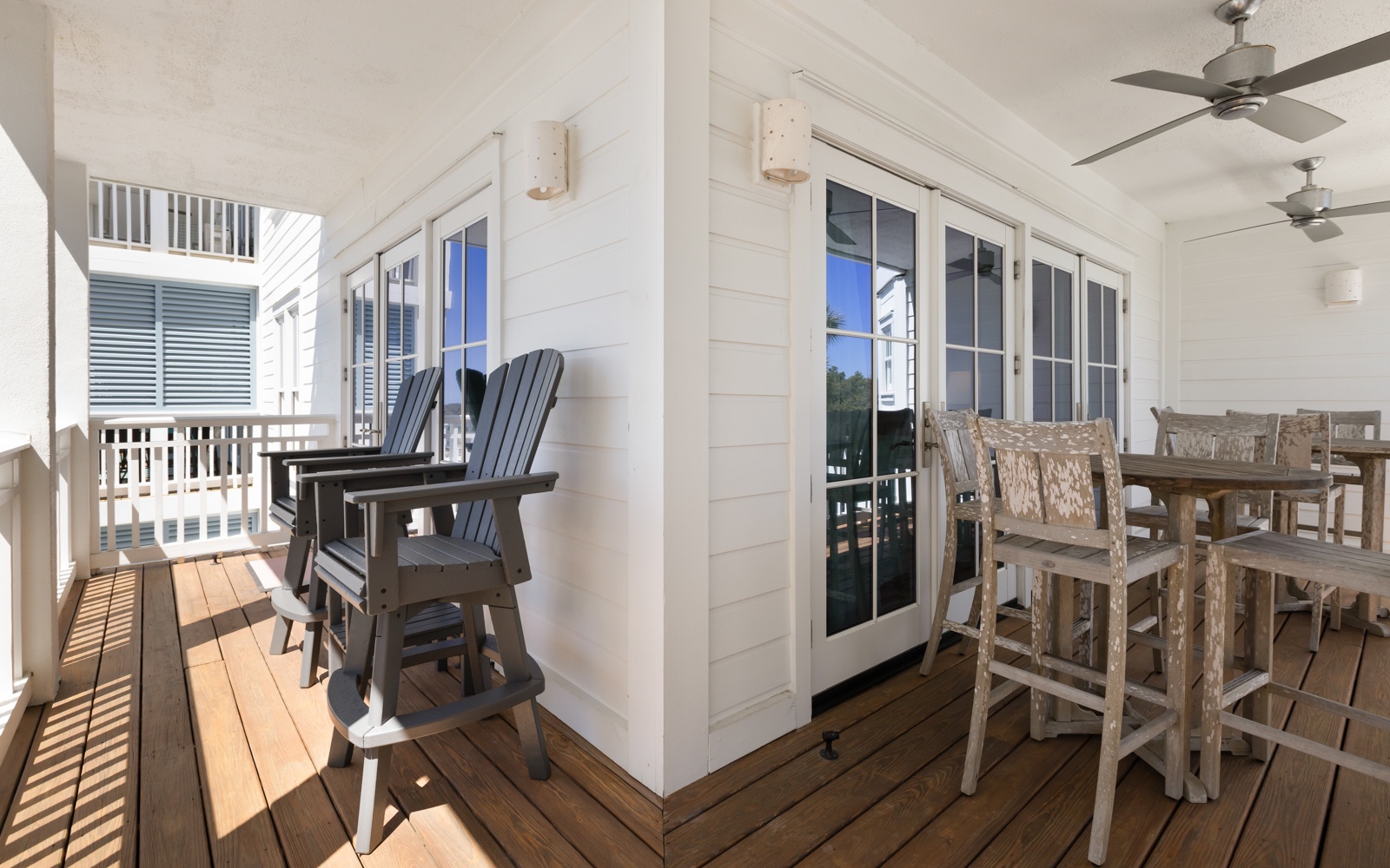 Your covered balcony offers the perfect spot to unwind with morning coffee or evening drinks, featuring comfortable seating and dining space.