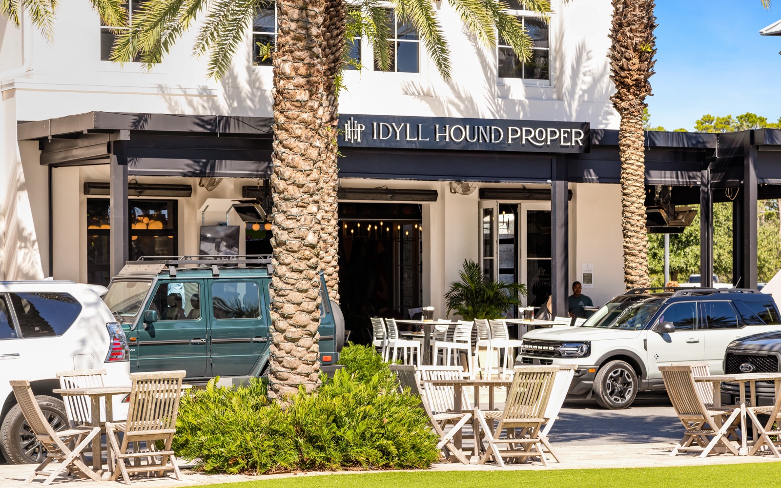 Stylish neighborhood restaurant with palm-lined outdoor seating creates the perfect spot for leisurely dining during your stay.