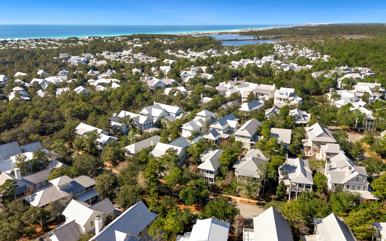 Scenic coastal community nestled between pristine beaches and lush forest, offering a peaceful retreat near the water.