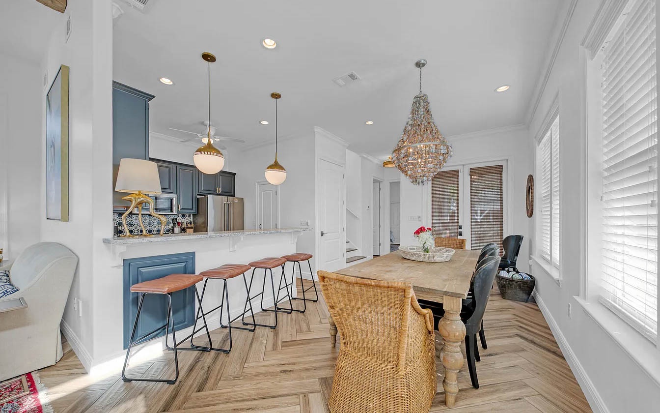 Gather around your spacious kitchen island with gleaming quartz counters and stylish blue cabinetry, perfect for morning coffee or evening cocktails.