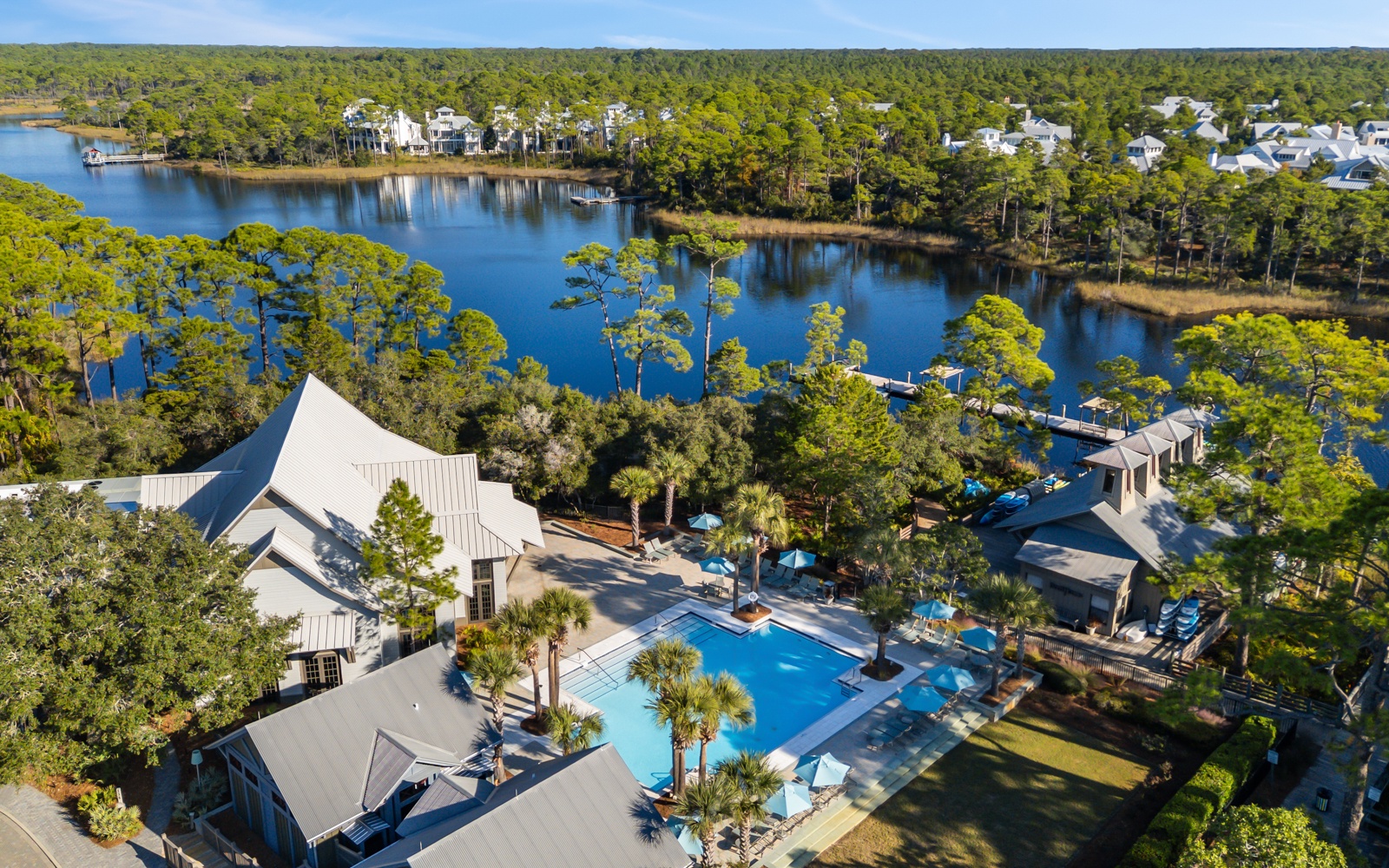 Stunning waterfront property nestled among towering pines with pristine lake access and resort-style amenities.