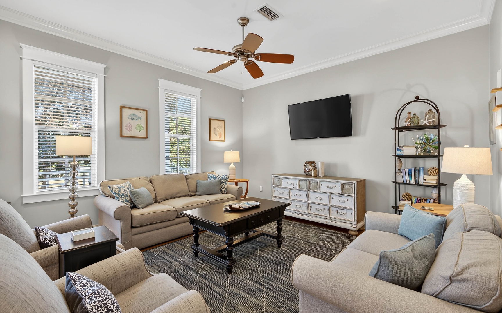Unwind in your elegant living room featuring plush seating, warm lighting, and modern entertainment - perfect for cozy evenings after exploring.