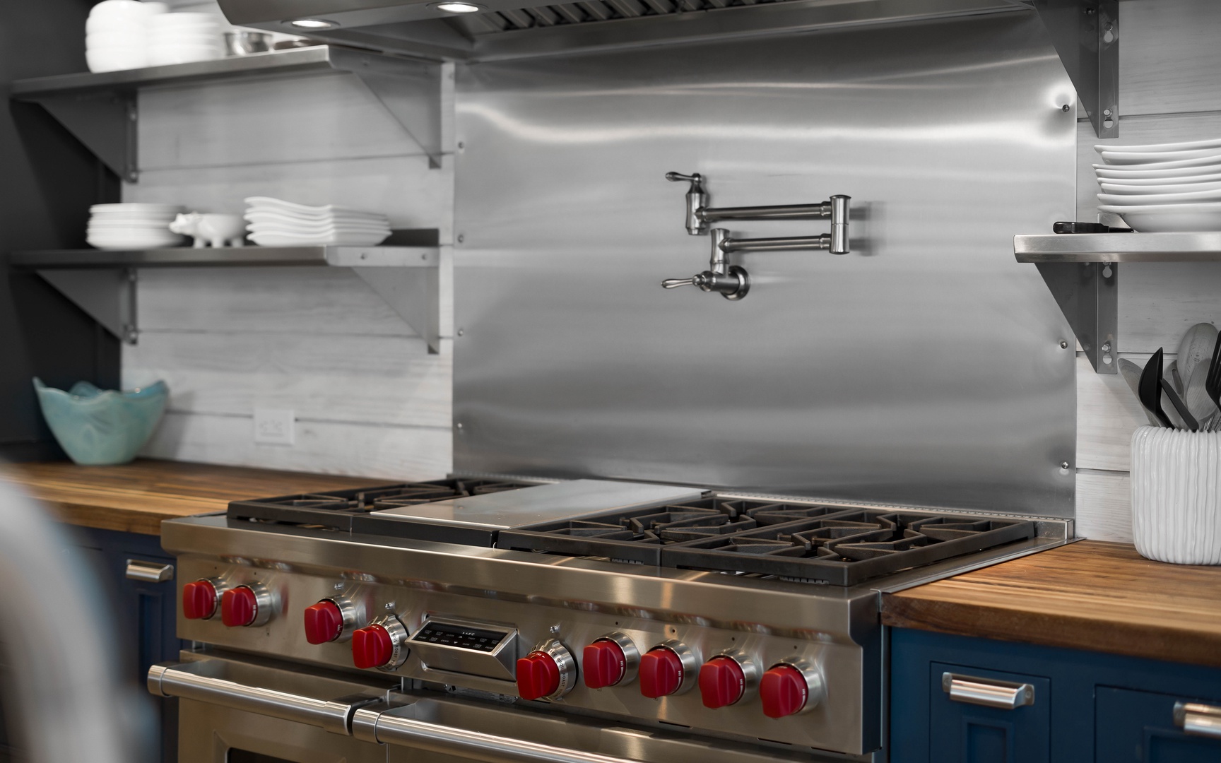 Create culinary masterpieces on your professional-grade gas range with pot filler convenience and abundant storage for all your cooking needs.