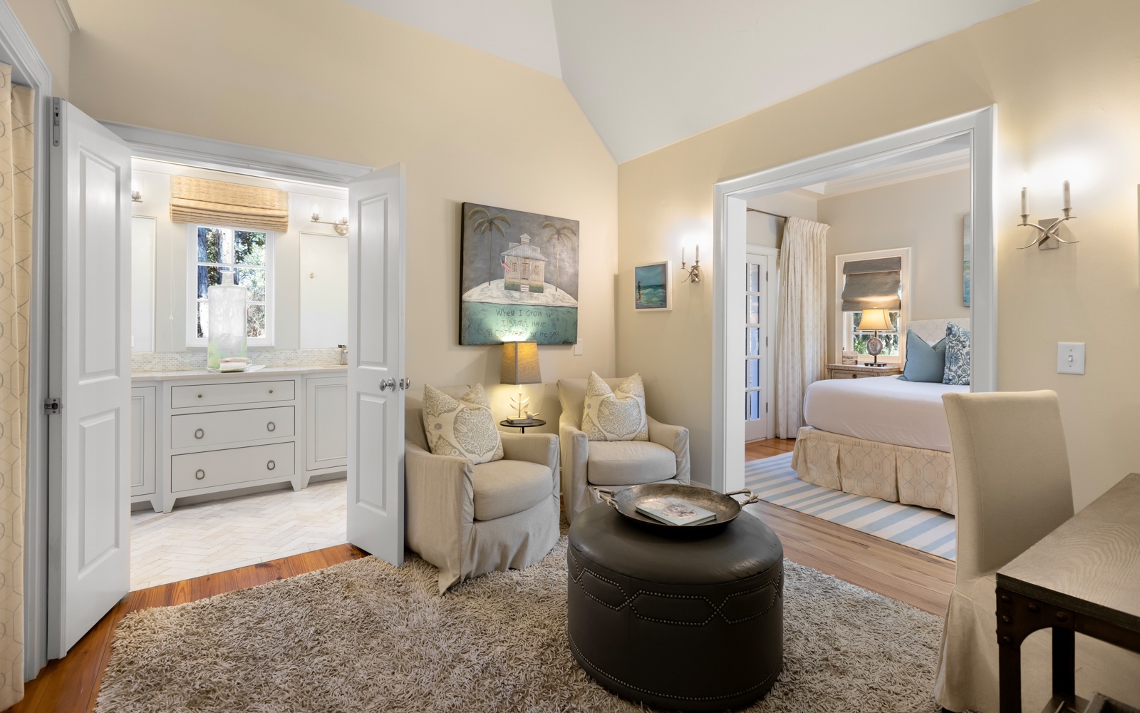 Your elegant suite features a cozy seating area with soft armchairs, perfect for unwinding after exploring the area.