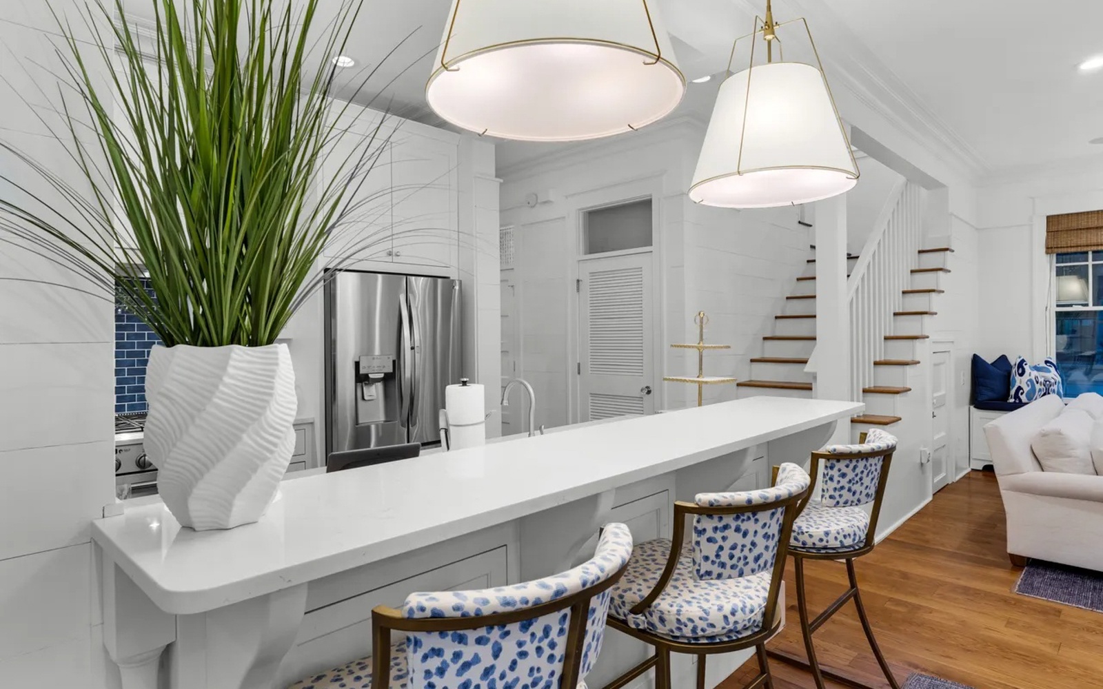 Your bright open kitchen invites morning coffee conversations at the sleek breakfast bar, while stainless appliances await your culinary adventures.