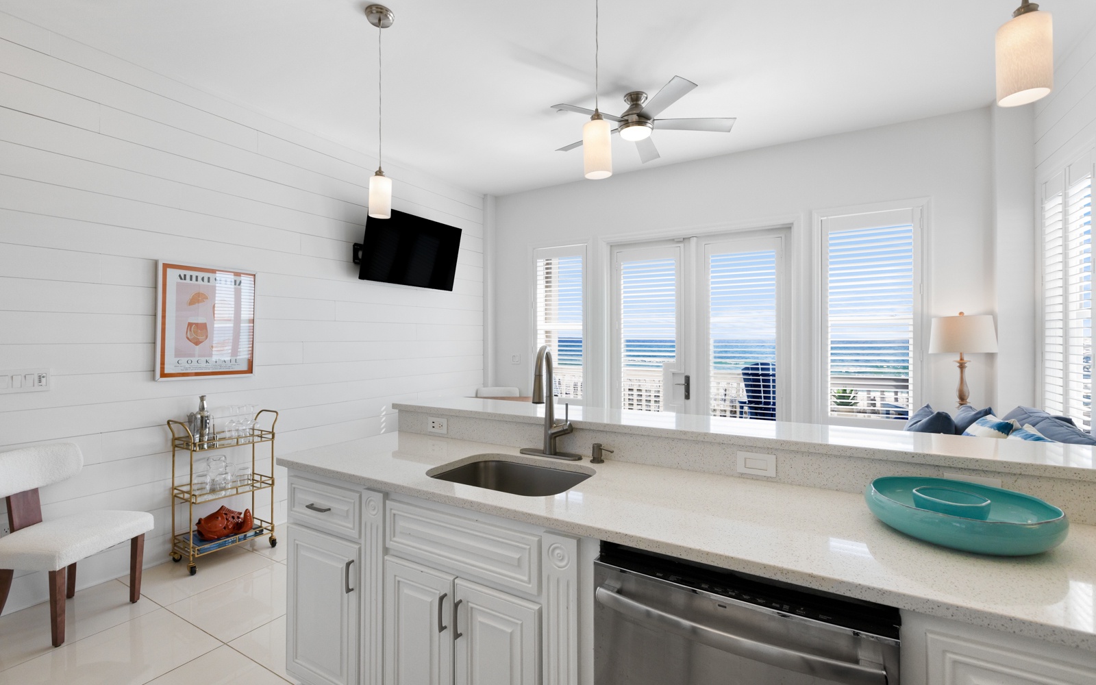 Your bright coastal kitchen offers modern appliances and stunning ocean views, perfect for morning coffee while watching waves roll in.