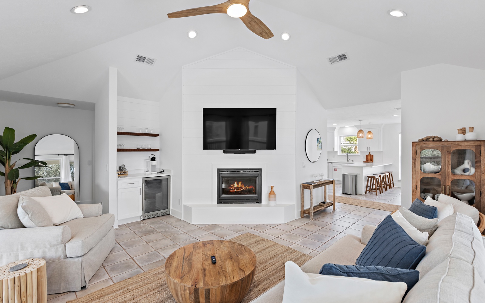 Relax in this bright open-concept space where cozy seating meets modern fireplace warmth, perfect for unwinding after your adventures.