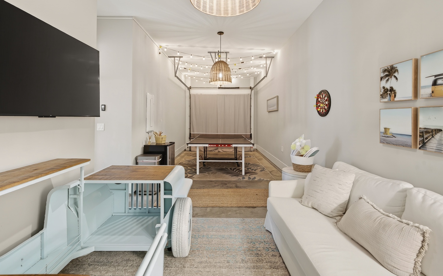 Your entertainment haven awaits with ping-pong table, dartboard, and cozy seating where laughter and friendly competition fill the air.