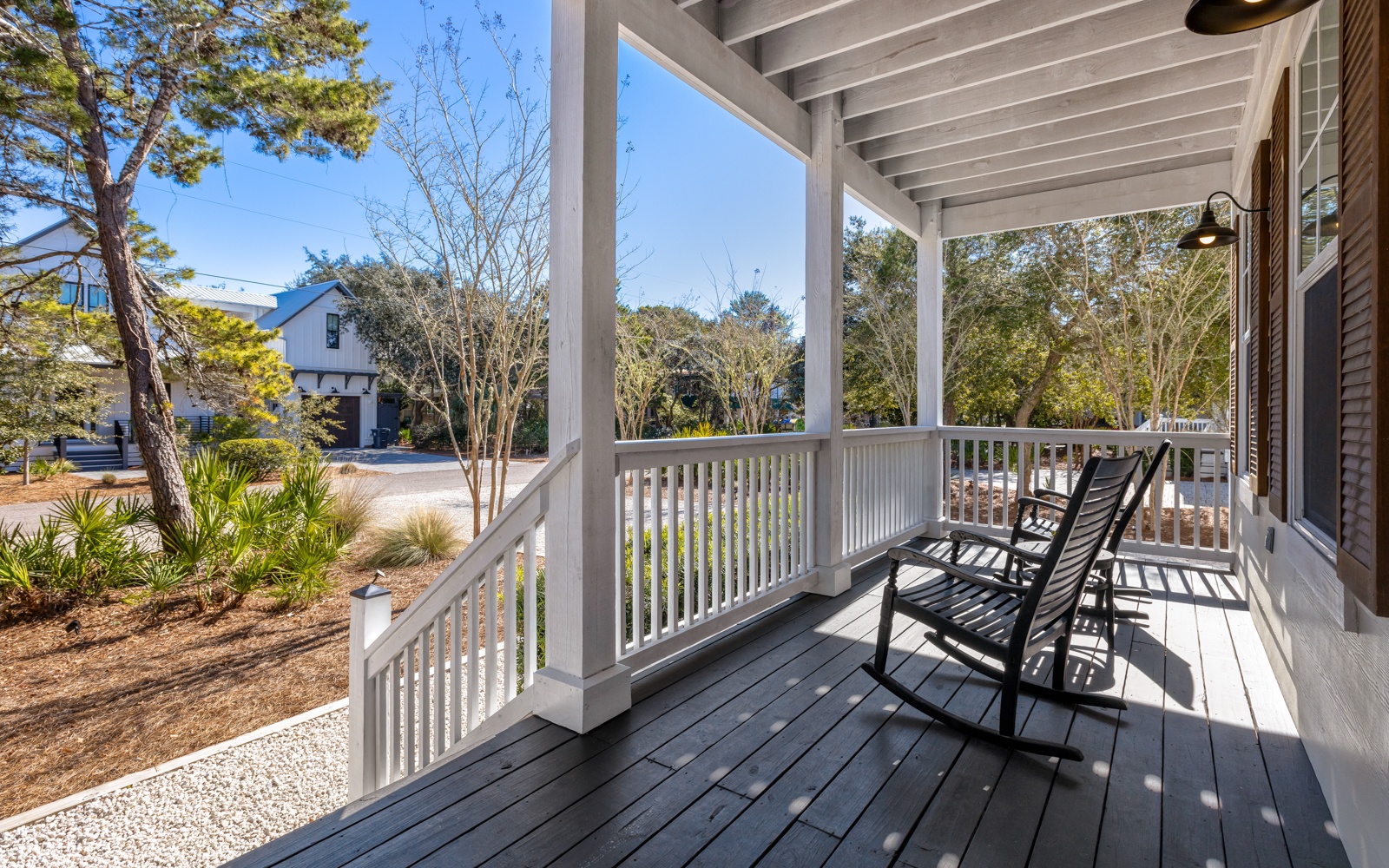 Your charming covered porch beckons with two rocking chairs where you'll sip morning coffee and watch the world wake up.